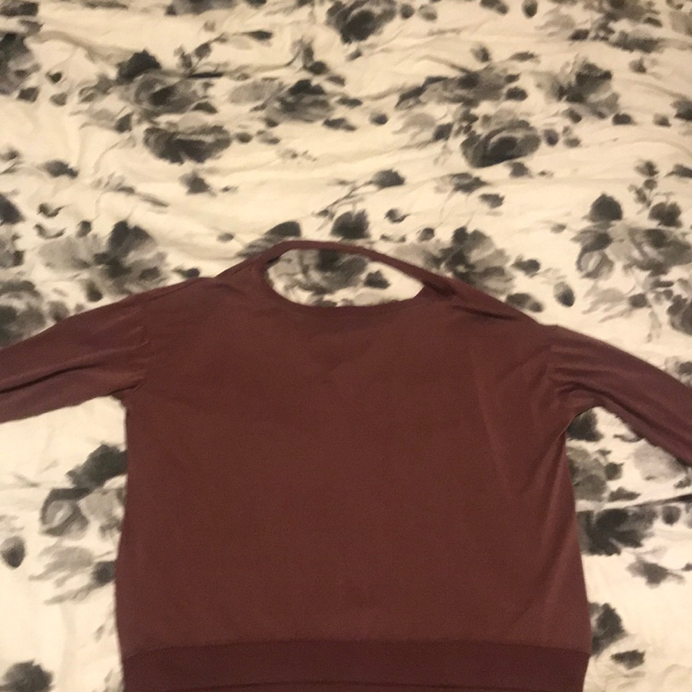 Never worn open back burgundy top
